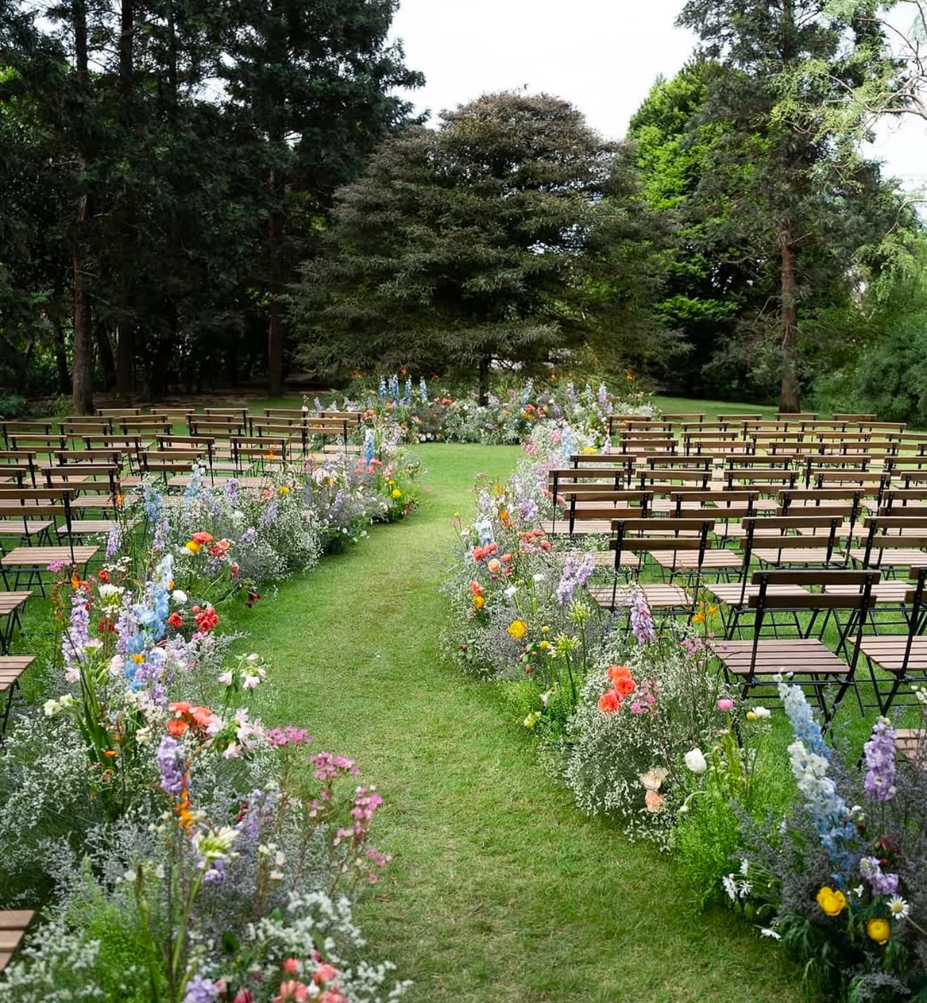 Modern wedding style with outdoor seating and floral path