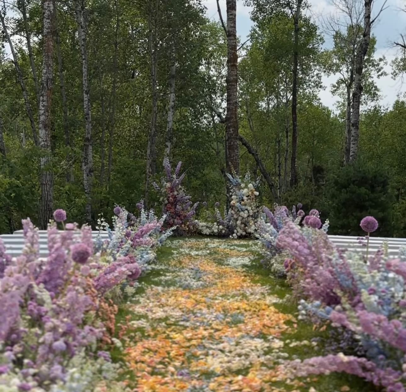 Magical wedding style with colorful flower path